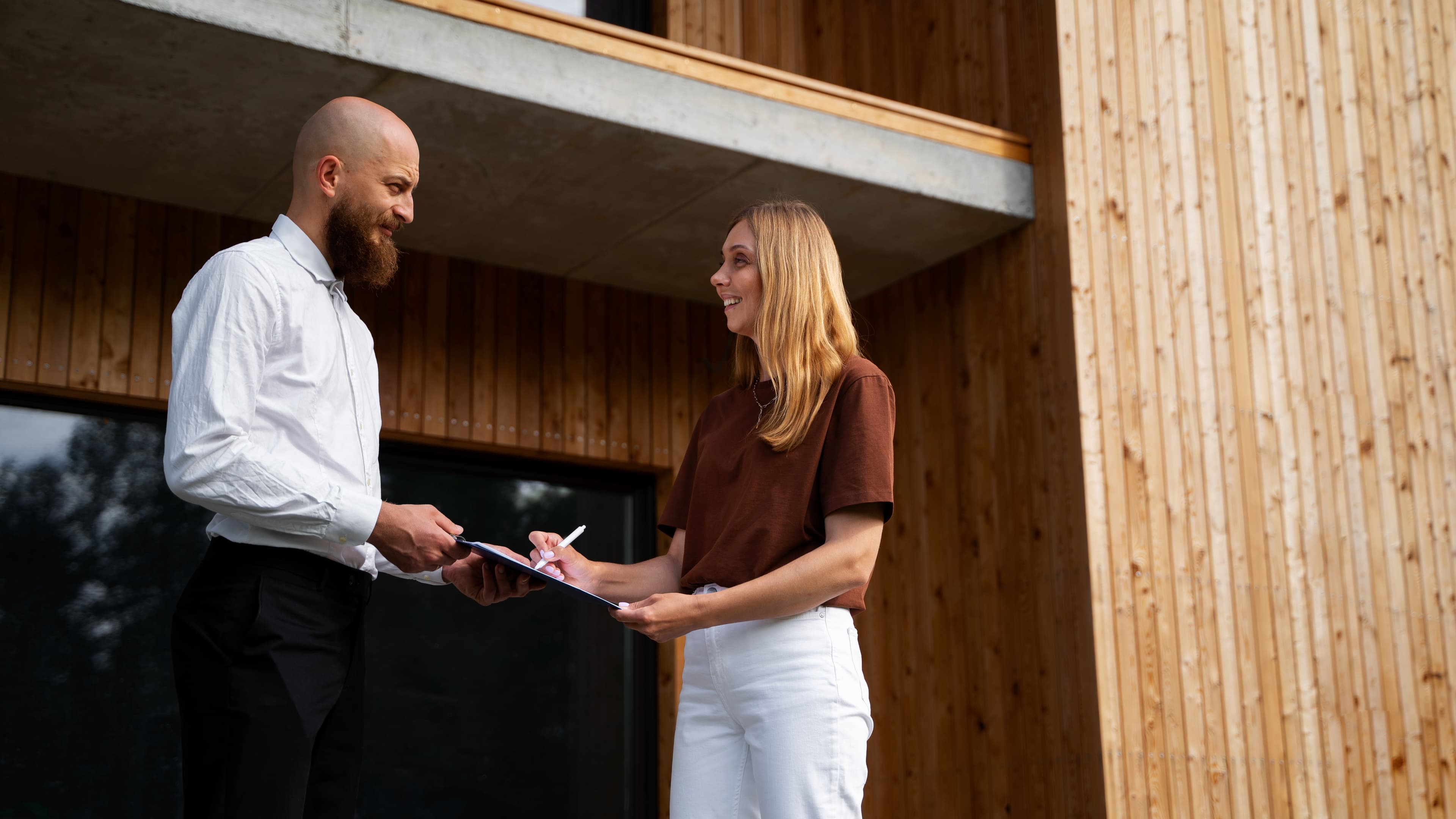 Woman working with real estate agent to purchase a home